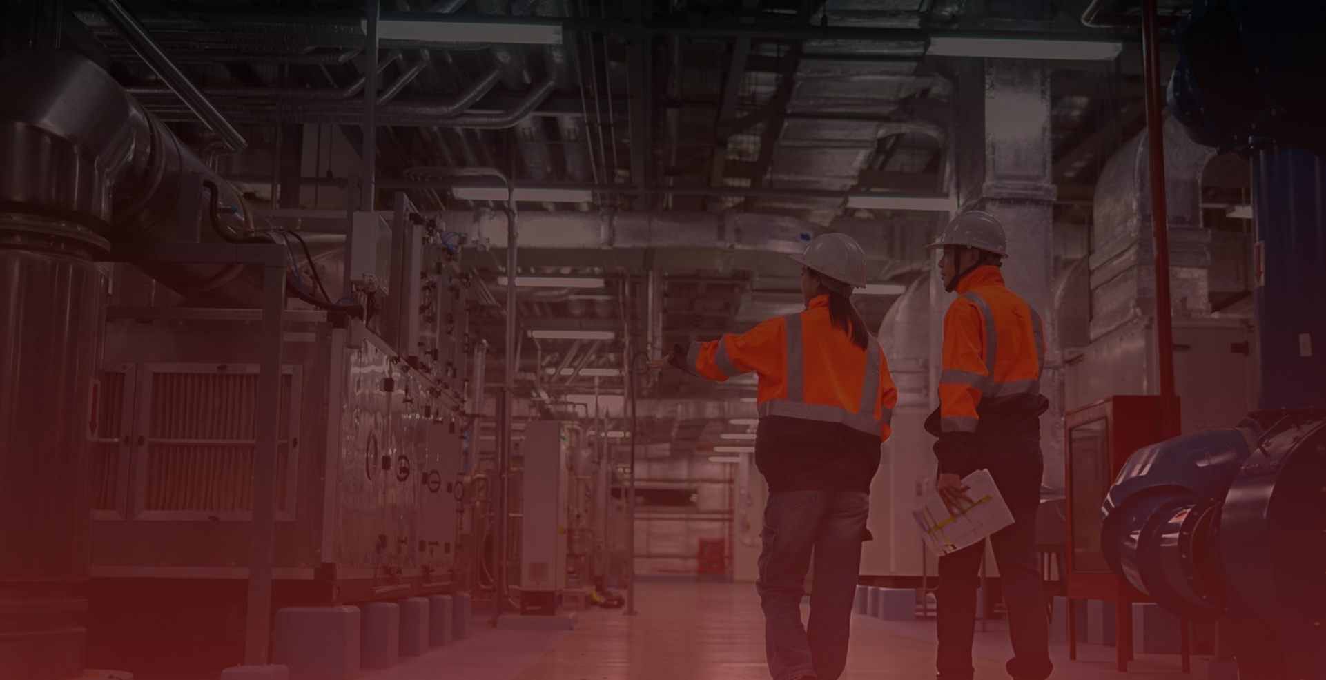 Worker walking through a modern manufacturing facility